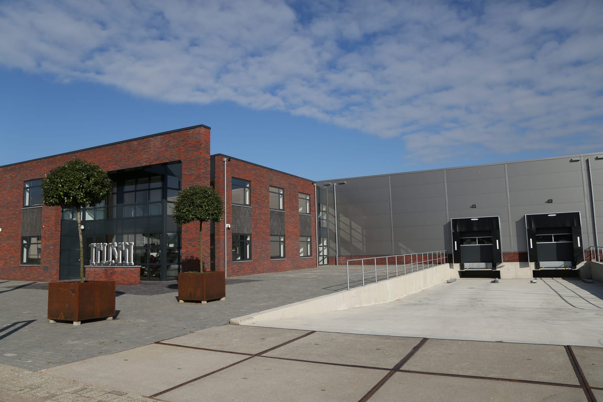 Reception and loading bay of the Teijsen building in Zeewolde in evening light