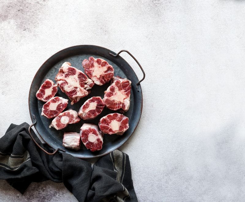 Beef oxtail pieces in a pan