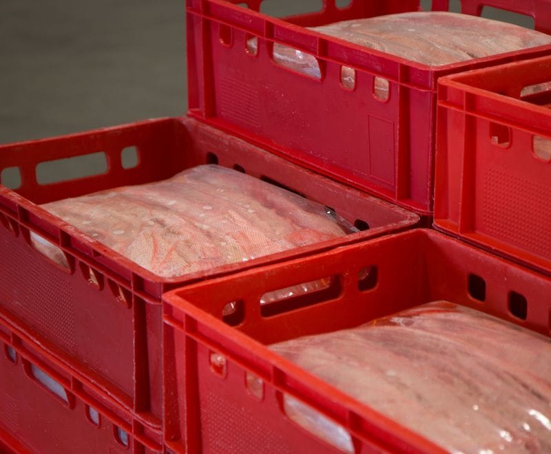 Red E2 crates filled with salted casings