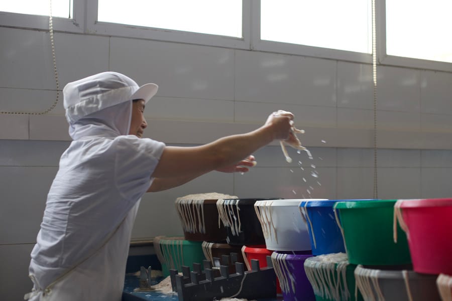 Salting casings by hand in buckets