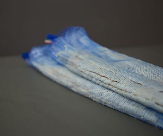 Sheep casings shirred on blue soft tubes